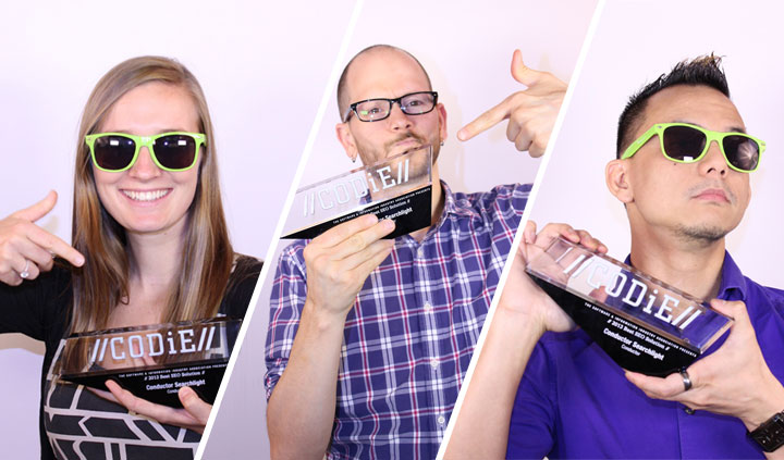 Searchlight Employees holding a CODiE award