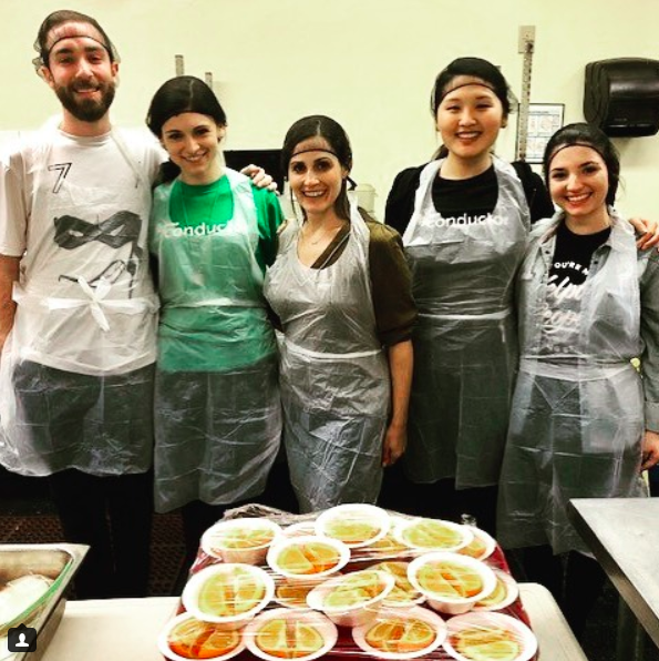 Conductor employees volunteering at a soup kitchen.