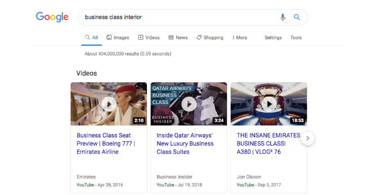 Search engine results page for business class interior on google featuring a video carousel